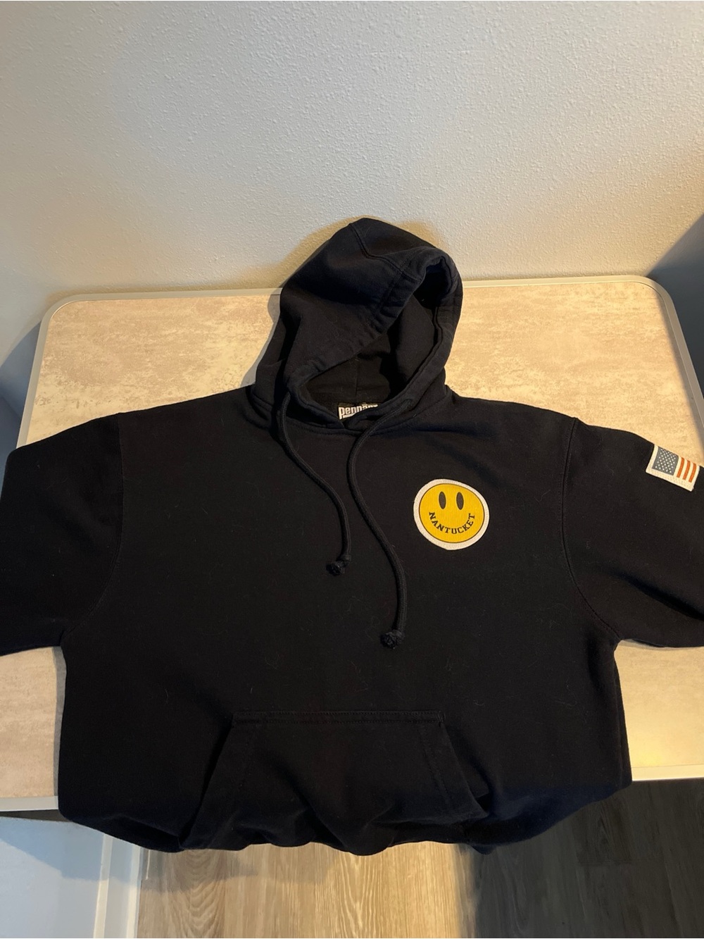 Pennant Sportswear x Black hoodie with stitched graphic patches,